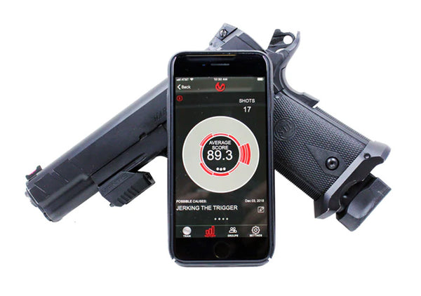 Handgun with Mantis X Training System Attached Showing Phone Screen and Graph on App