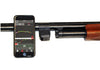 Shotgun with Mantis X10 Attached Showing Phone App Screen While Leaning Against Gun